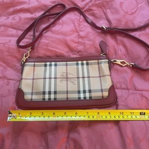 Burberry purse with red trim